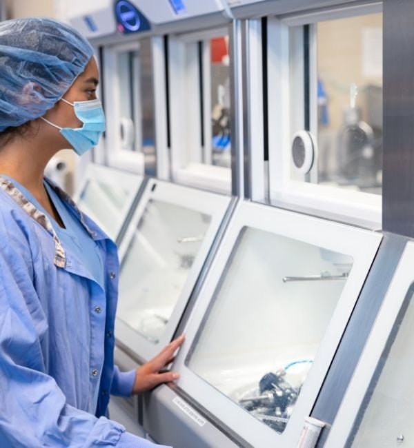 Technician reviewing AER cycle data as part of high-level disinfection tracking.